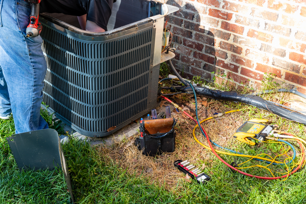 Air conditioner service being performed